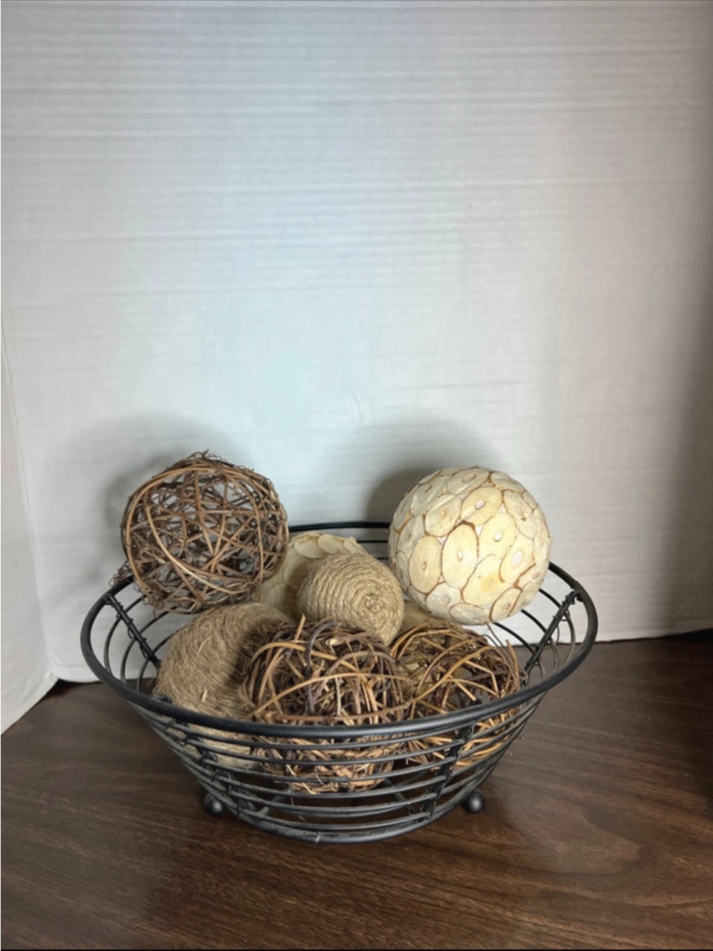 Black iron basket and wooden balls decor